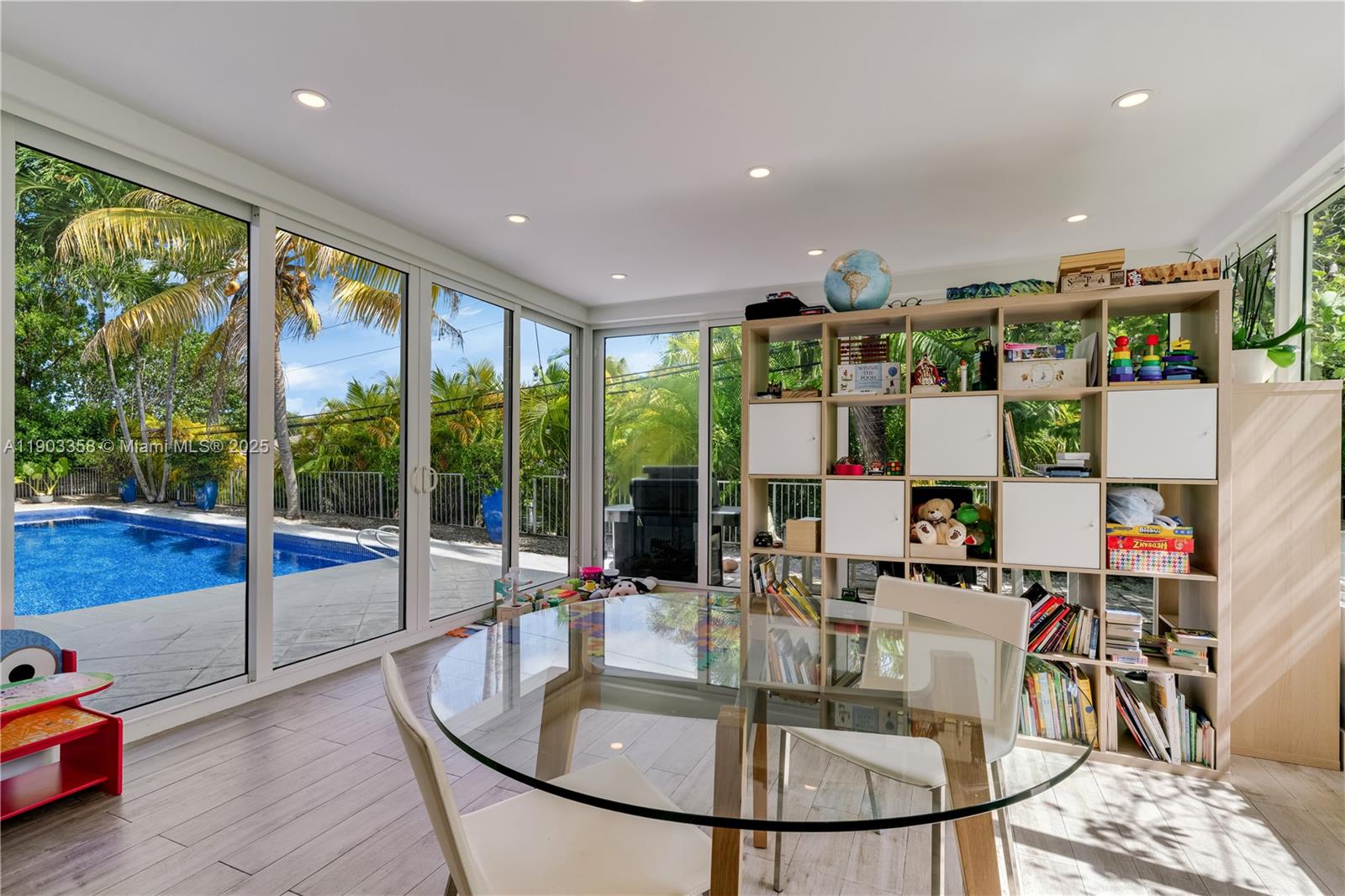 525 Ridgewood Road Key Biscayne, FL 33149 - Photo 60 of 62 a very nice looking dining room with a table and chairs