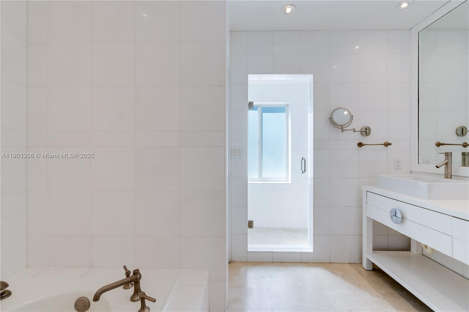 525 Ridgewood Road Key Biscayne, FL 33149 - Photo 7 of 62 a bathroom with a sink and a mirror