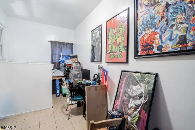 a room with furniture and painting on the wall