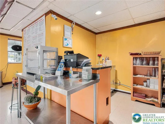 a kitchen with a sink appliances and cabinets