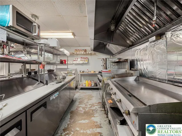 a kitchen with stainless steel appliances granite countertop lots of counter top space