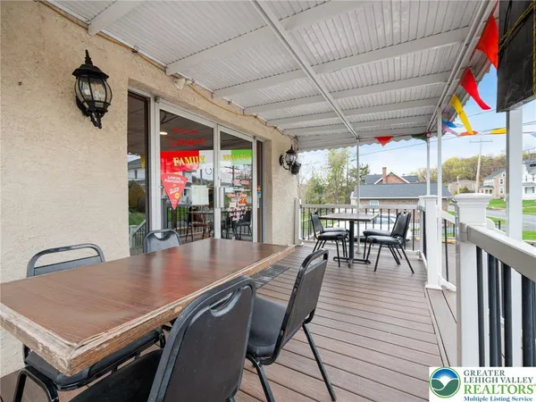 a outdoor dining space with furniture and outdoor view