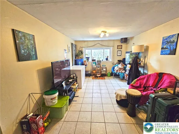 a view of living room with furniture and a window