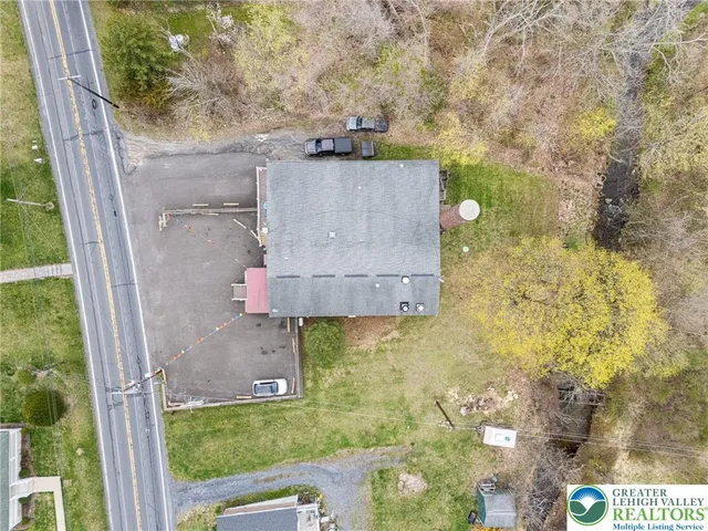 aerial view of residential house with outdoor space