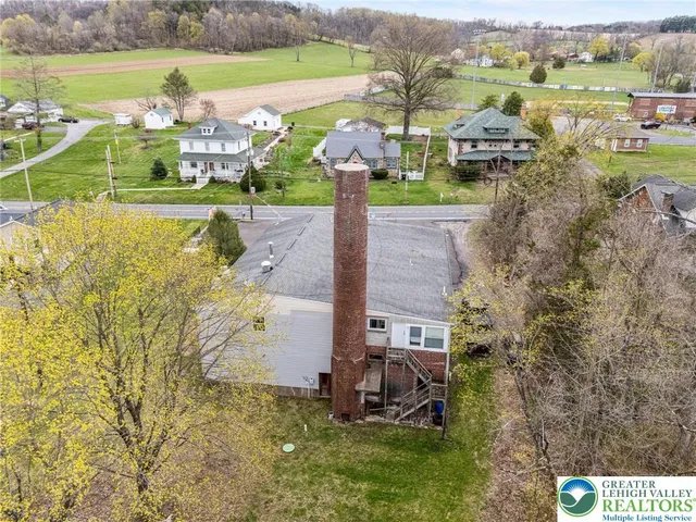 a view of a town with mountains in the background