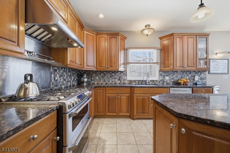 115 Mt Lebanon Road Glen Gardner, NJ 08826 - Photo 11 of 49 a kitchen with stainless steel appliances granite countertop a sink stove and cabinets