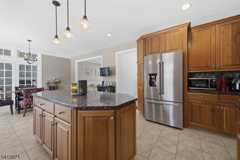 115 Mt Lebanon Road Glen Gardner, NJ 08826 - Photo 13 of 49 a kitchen with stainless steel appliances granite countertop a refrigerator a sink a stove and chairs