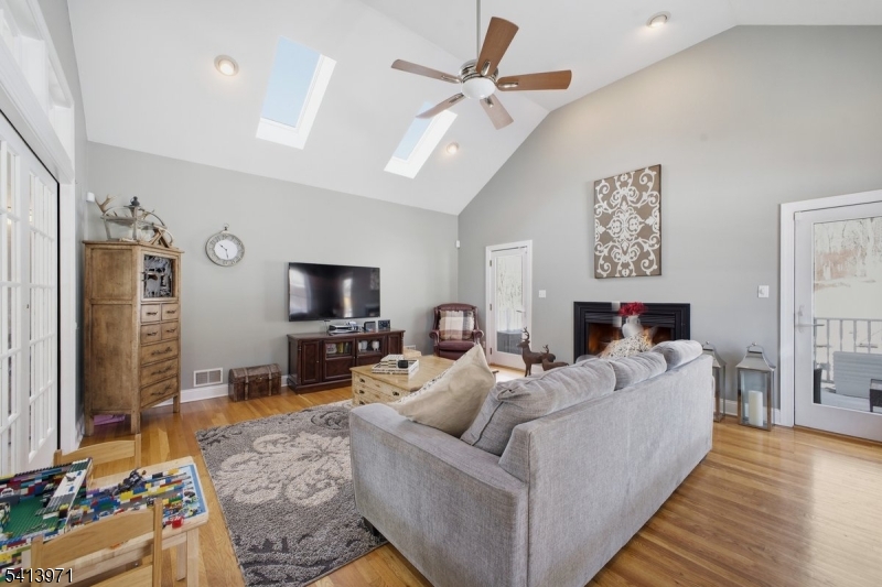 115 Mt Lebanon Road Glen Gardner, NJ 08826 - Photo 16 of 49 a living room with furniture and a flat screen tv