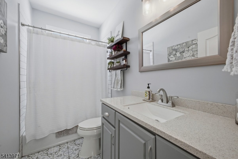 115 Mt Lebanon Road Glen Gardner, NJ 08826 - Photo 19 of 49 a bathroom with a granite countertop sink toilet and a mirror