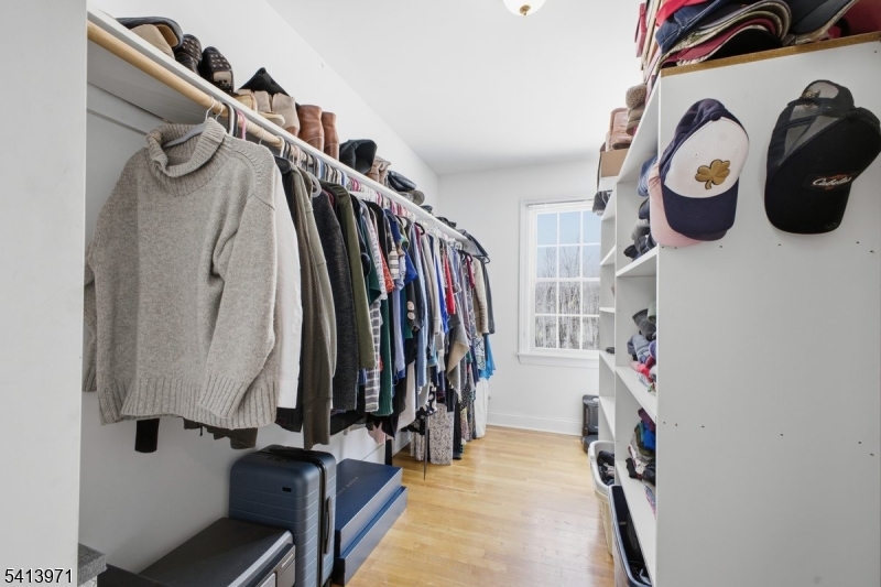 115 Mt Lebanon Road Glen Gardner, NJ 08826 - Photo 27 of 49 a view of walk in closet with clothes and shoes