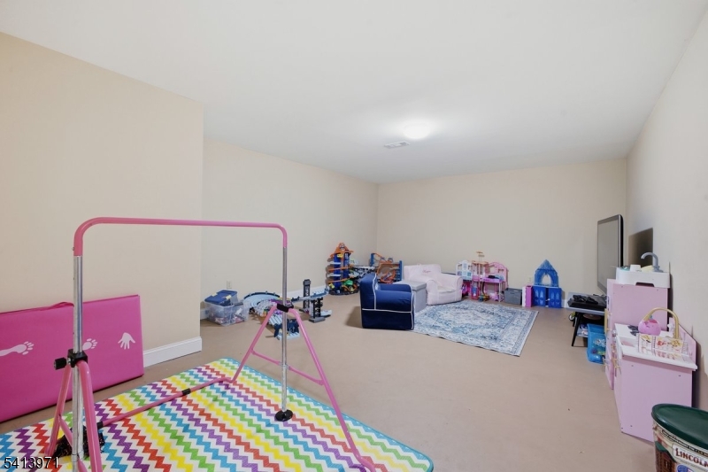 115 Mt Lebanon Road Glen Gardner, NJ 08826 - Photo 37 of 49 a bed room with a bed and gym equipment
