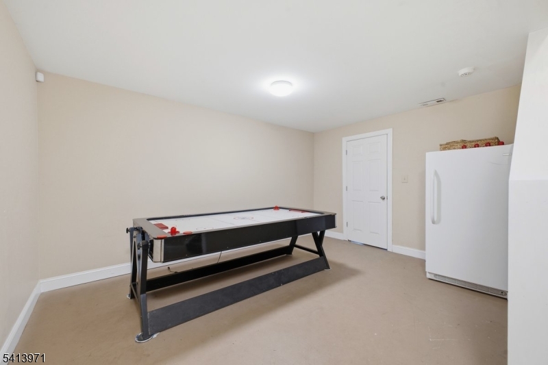 115 Mt Lebanon Road Glen Gardner, NJ 08826 - Photo 38 of 49 a room with a bed and a table in it