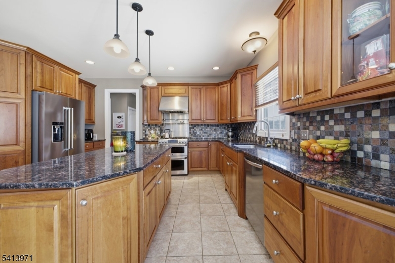 115 Mt Lebanon Road Glen Gardner, NJ 08826 - Photo 8 of 49 a kitchen with stainless steel appliances granite countertop a sink a stove and a refrigerator