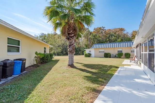 a view of a yard and front view of a house