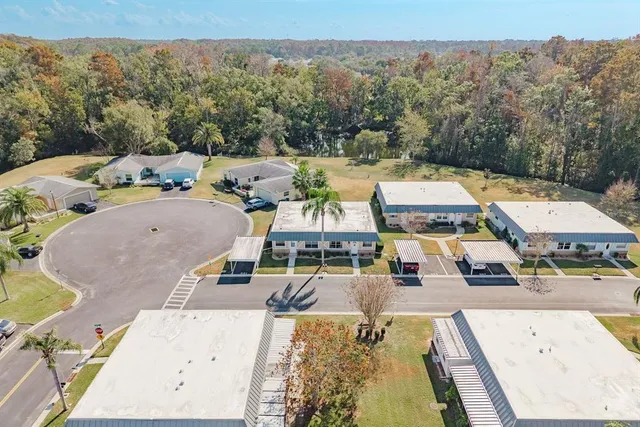 an aerial view of a house with a swimming pool
