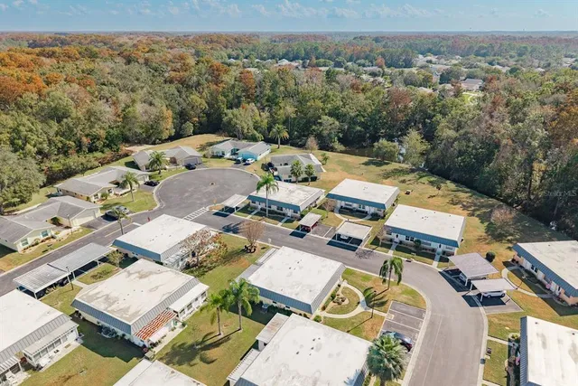 an aerial view of a house with a big yard