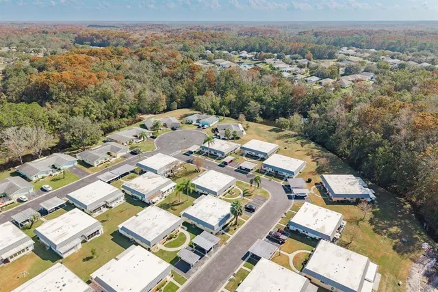 an aerial view of a residential houses with city view