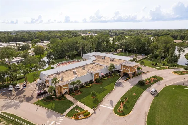 an aerial view of a house with yard swimming pool and outdoor seating