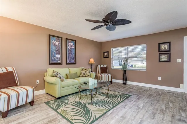 a living room with furniture and a window