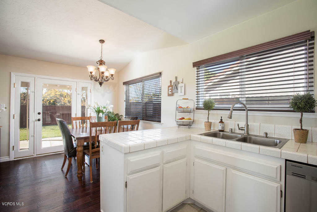 4713 Avedon Road Moorpark, CA 93021 - Photo 14 of 33 a kitchen with sink table and chairs