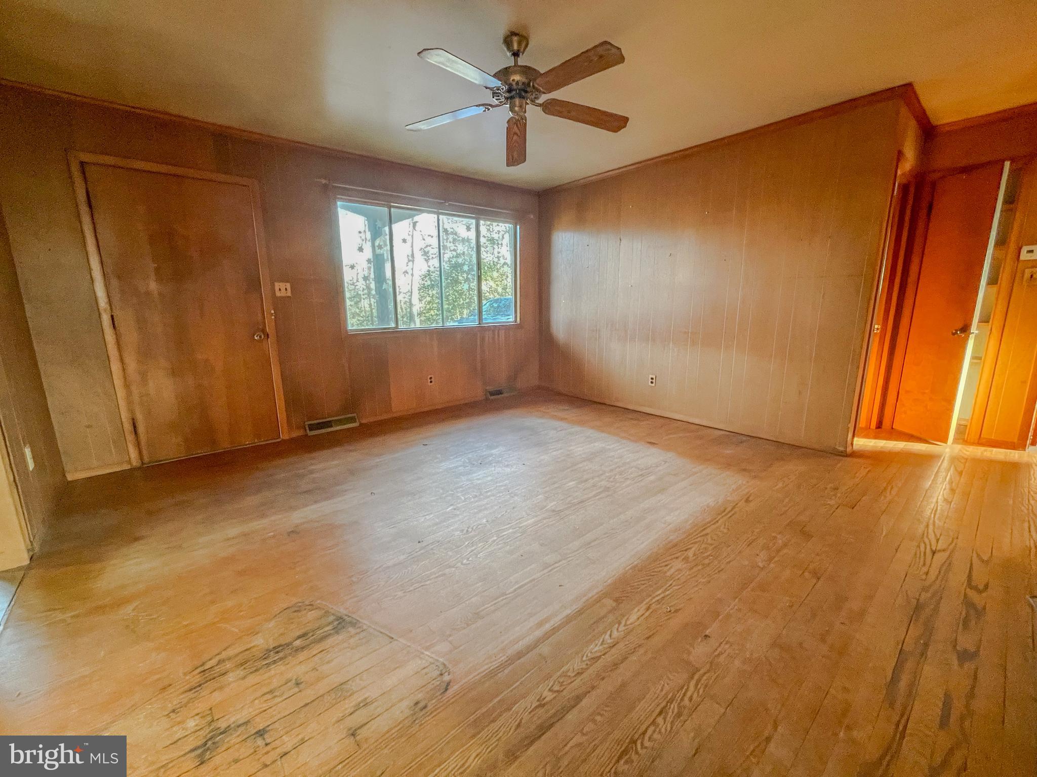 12403 Ridge Road Lusby, MD 20657 - Photo 5 of 16 Real wood floors and lots of light welcome you.
