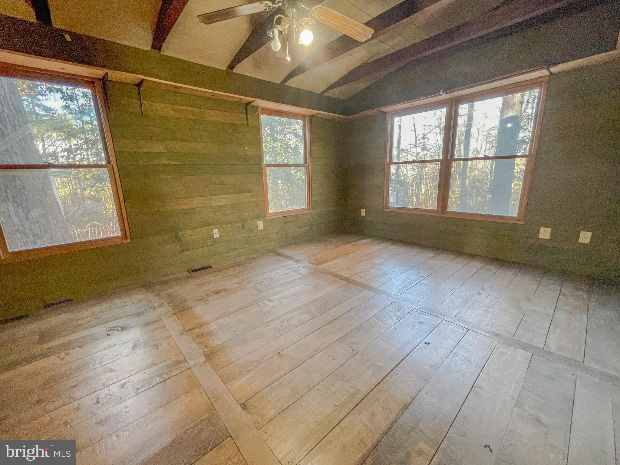 12403 Ridge Road Lusby, MD 20657 - Photo 6 of 16 Spacious primary offers stunning wood floors.