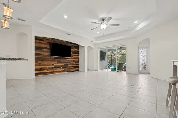 a view of kitchen with furniture and flat screen tv