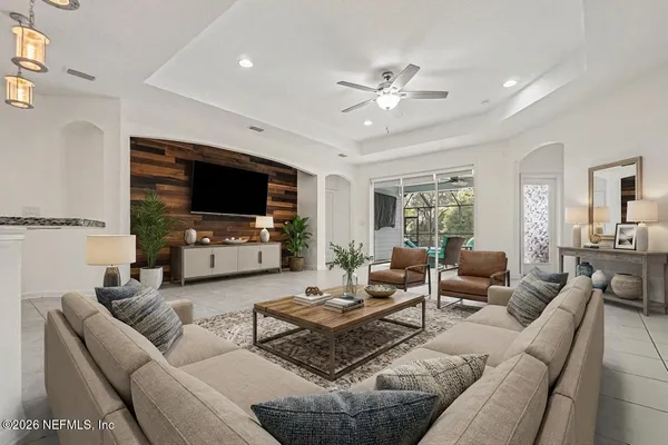 a living room with furniture and a flat screen tv
