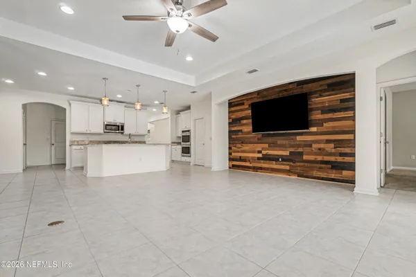 a kitchen with stainless steel appliances granite countertop a sink stove and microwave