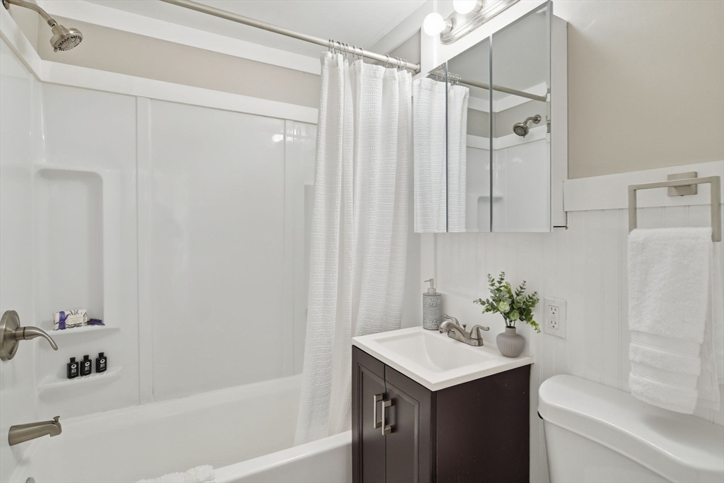 118 Pilgrim Road Springfield, MA 01118 - Photo 17 of 24 a bathroom with a sink and a mirror