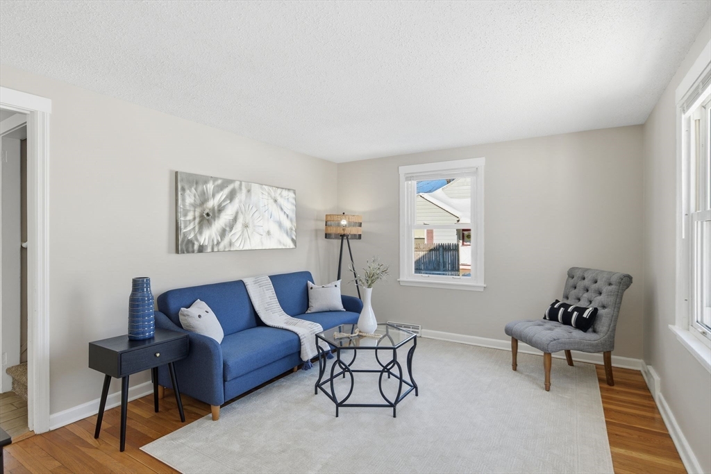 118 Pilgrim Road Springfield, MA 01118 - Photo 7 of 24 a living room with furniture and a window