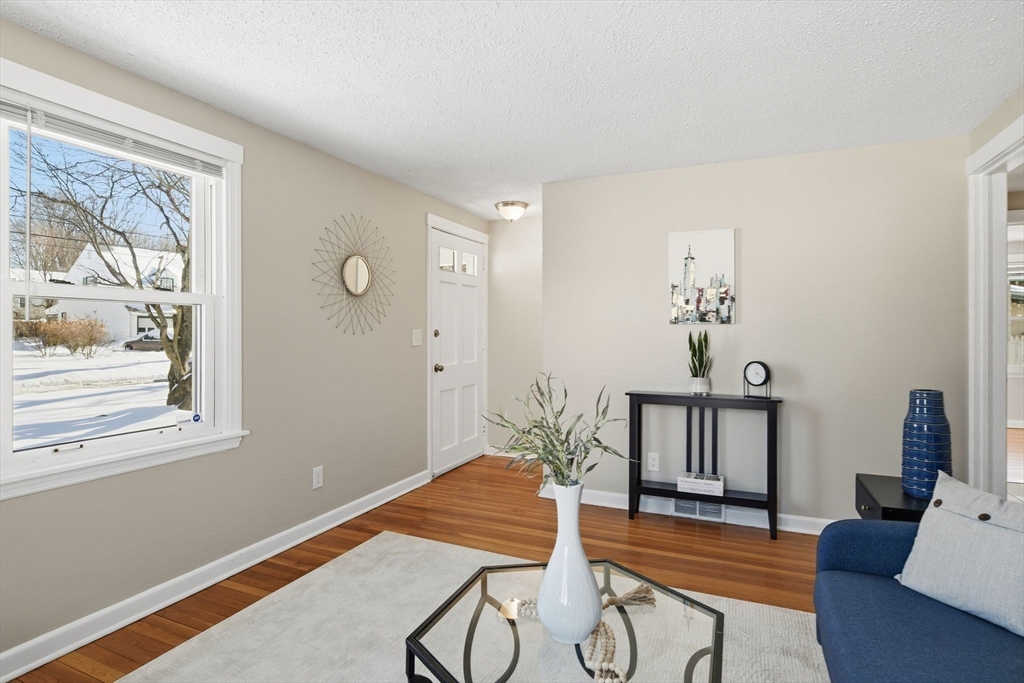 118 Pilgrim Road Springfield, MA 01118 - Photo 9 of 24 a bedroom with furniture and wooden floor