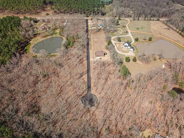 a aerial view of a house with a yard