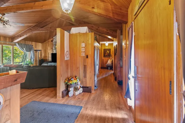 a dining room with furniture and wooden floor