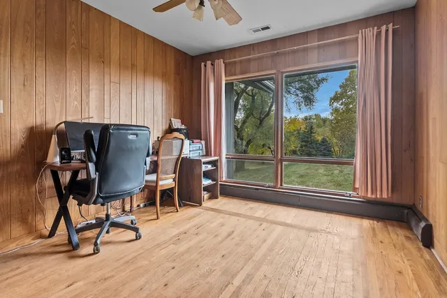 a bedroom with a bed and flat screen tv