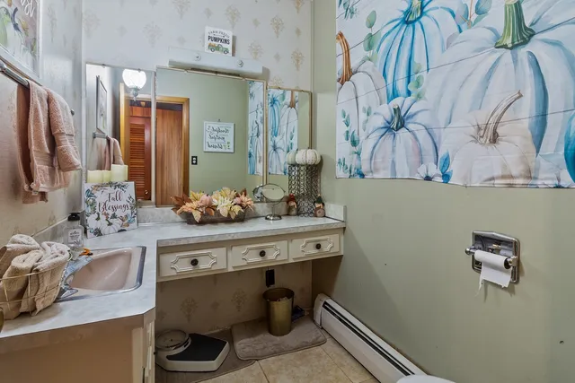 a living room with furniture a window and a fireplace