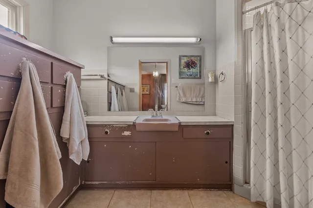 a living room with furniture a rug and a large window