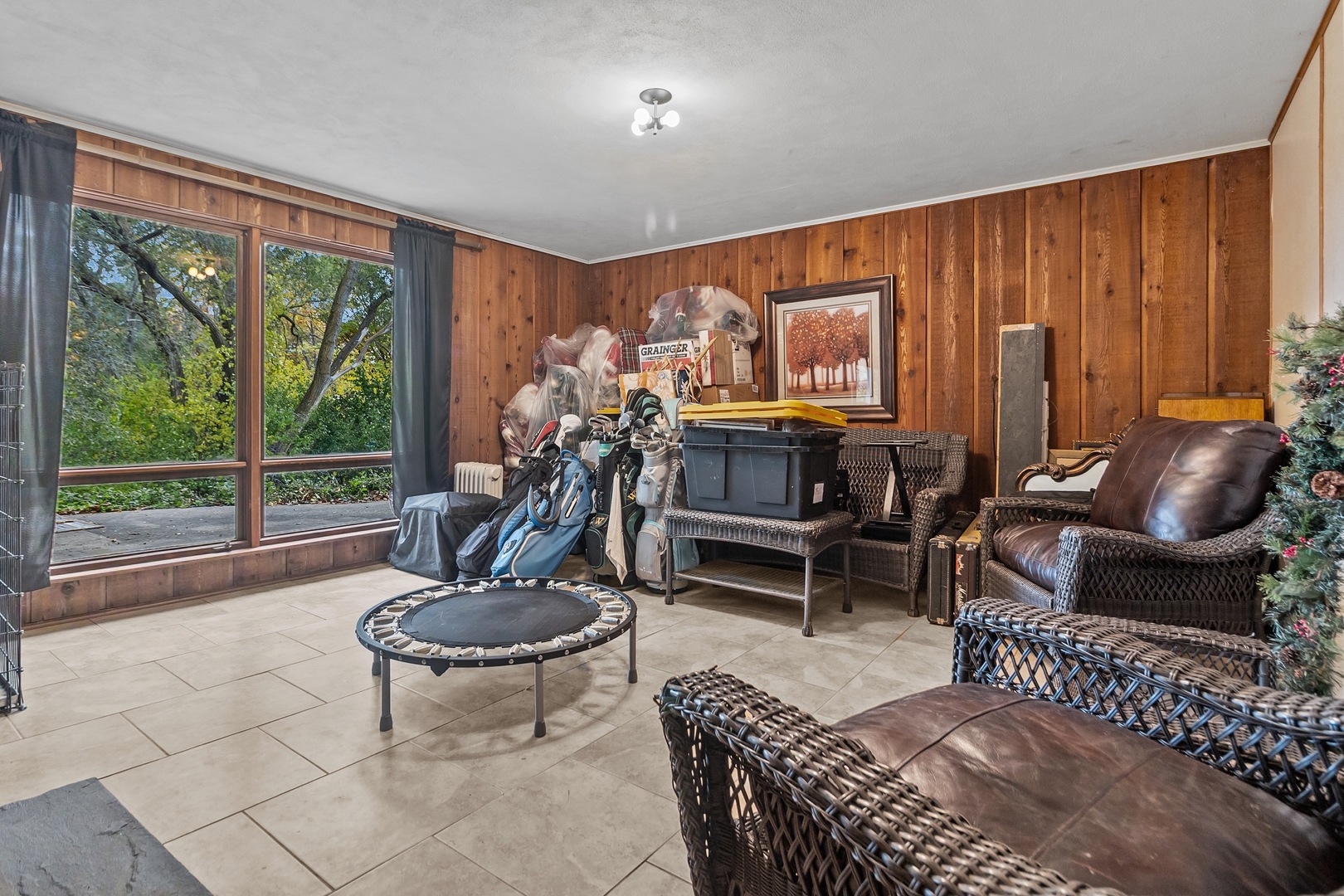 7822 North Pillow Hill Road Spring Grove, IL 60081 - Photo 31 of 34 a living room with furniture a rug and a large window