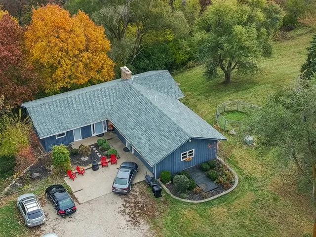 a aerial view of a house with a yard