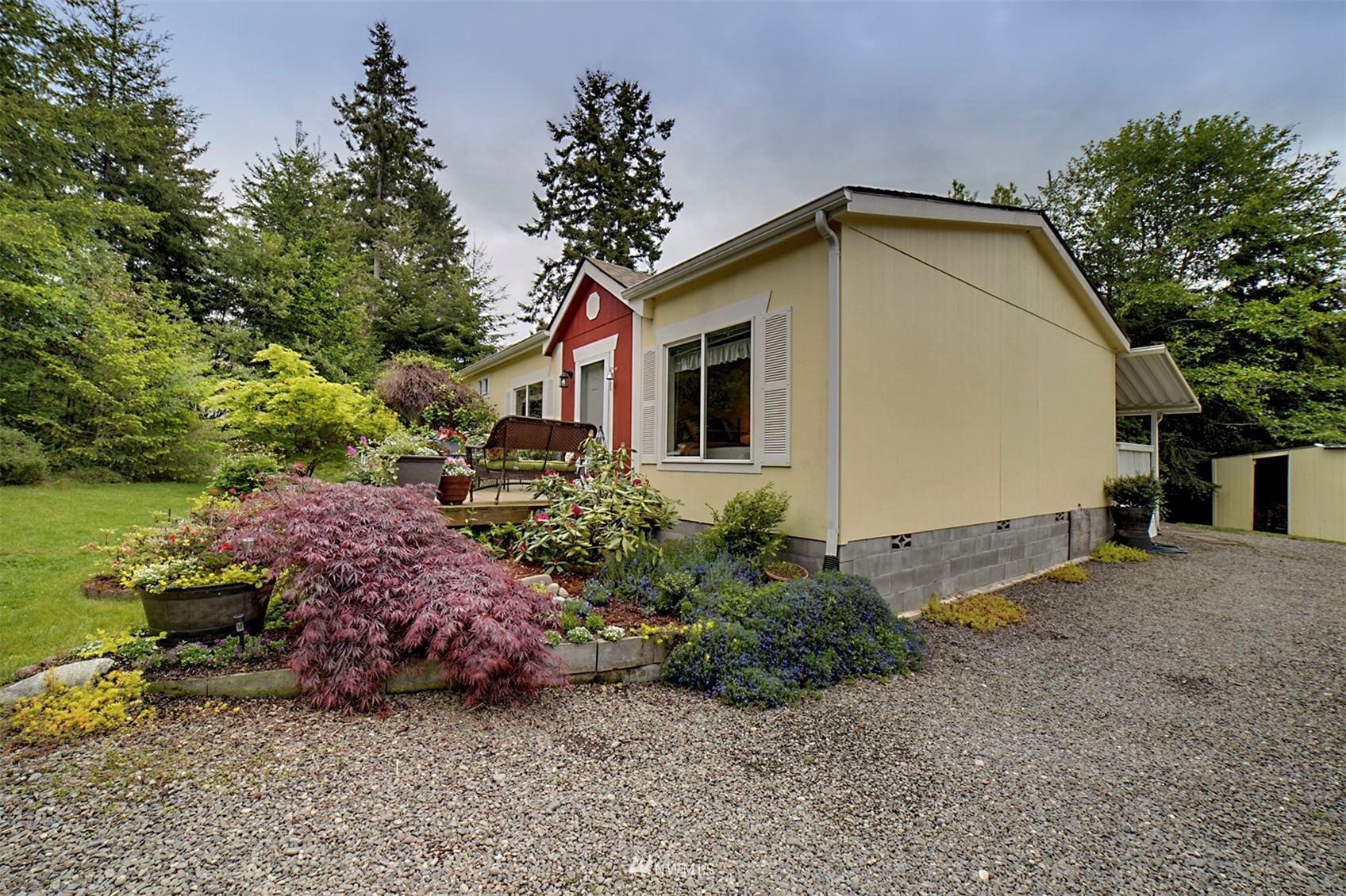 415 Port Hadlock Heights Road Port Hadlock, WA 98339 - Photo 35 of 39 a view of a house with a yard and potted plants