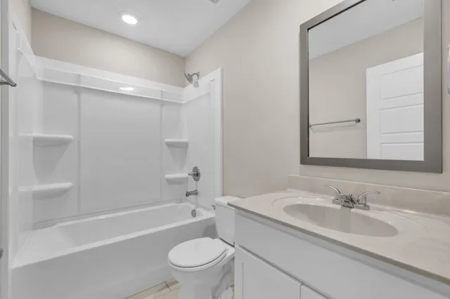 a bathroom with a sink toilet and a bathtub