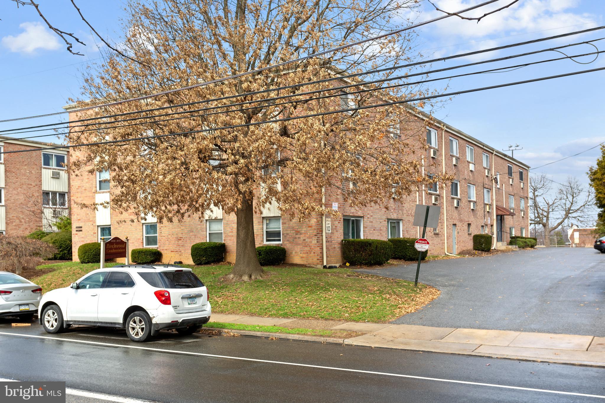 8115 West Chester Pike, Unit C3 Upper Darby, PA 19082 - Photo 1 of 14 a white car parked in front of a building