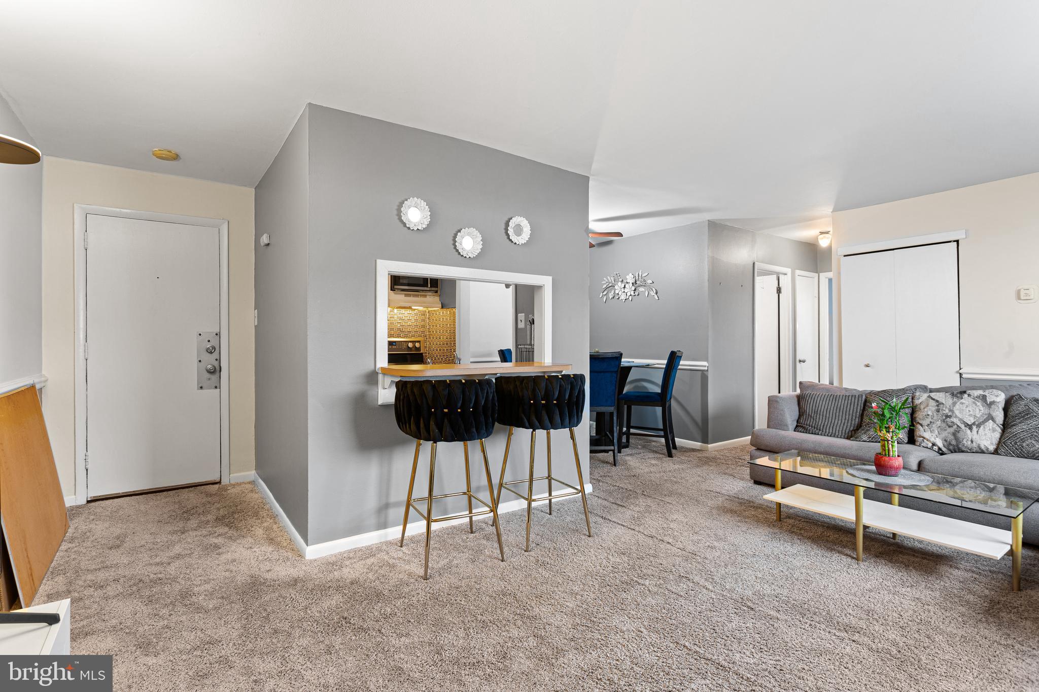 8115 West Chester Pike, Unit C3 Upper Darby, PA 19082 - Photo 2 of 14 a living room with furniture and a table