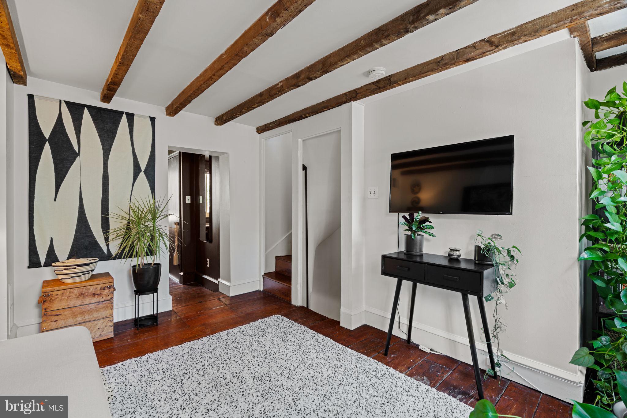 142 Carpenter Street Philadelphia, PA 19147 - Photo 32 of 49 a living room with furniture and a flat screen tv