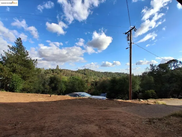 a view of a road with a yard