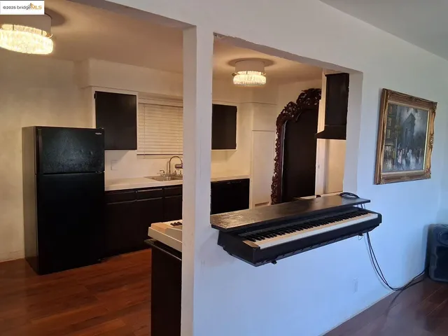 a view of kitchen with furniture and wooden floor