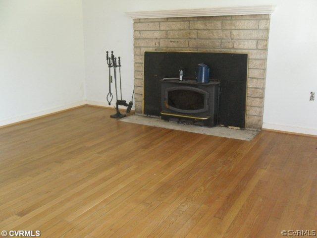 234 Wickham Road Bumpass, VA 23024 - Photo 3 of 7 a view of empty room with a fireplace