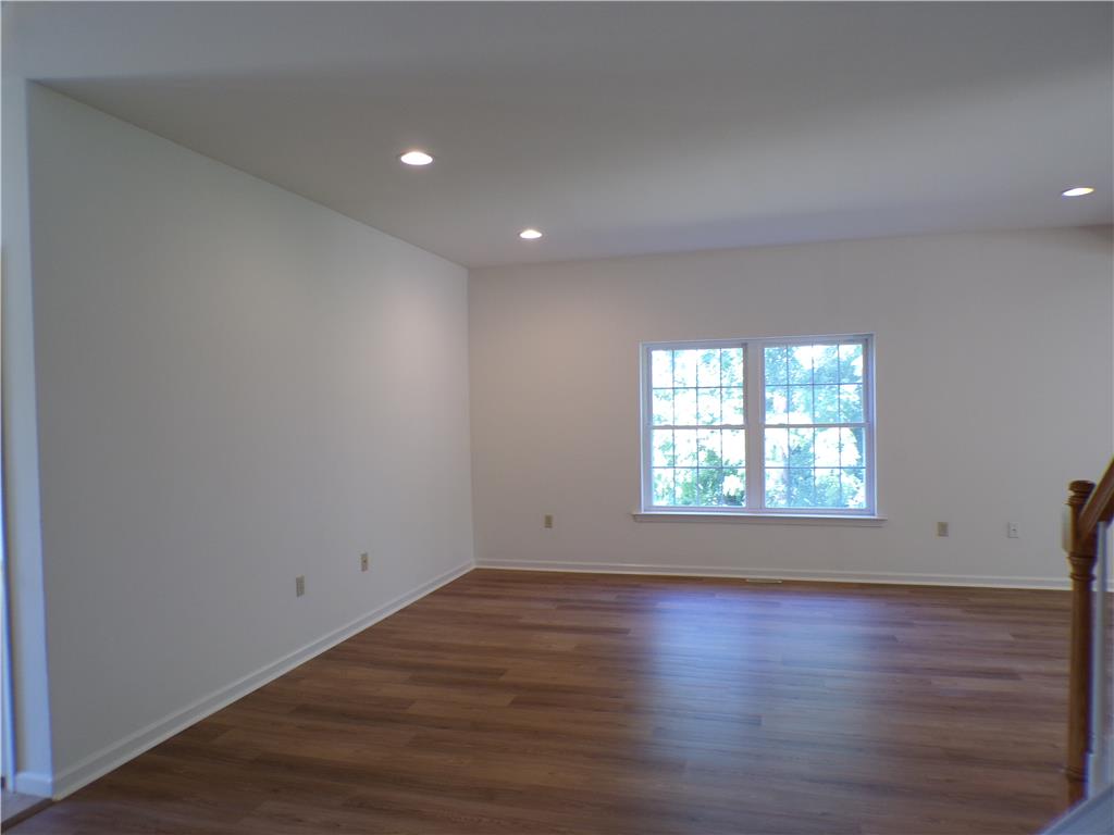 3283 Seip Road Macungie, PA 18062 - Photo 4 of 33 Recessed lighting illuminates wood flooring, creating an inviting, airy space.