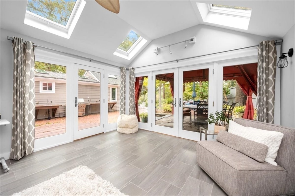 3 Howland Lane Hingham, MA 02043 - Photo 11 of 42 a spacious bedroom with a large window and a couch