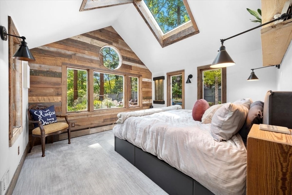 3 Howland Lane Hingham, MA 02043 - Photo 13 of 42 a bed sitting in a bedroom next to a window